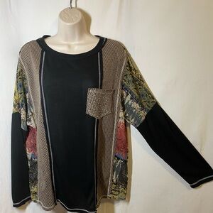 Vocal lightweight black top with sheer side panels, bling pocket relaxed fit